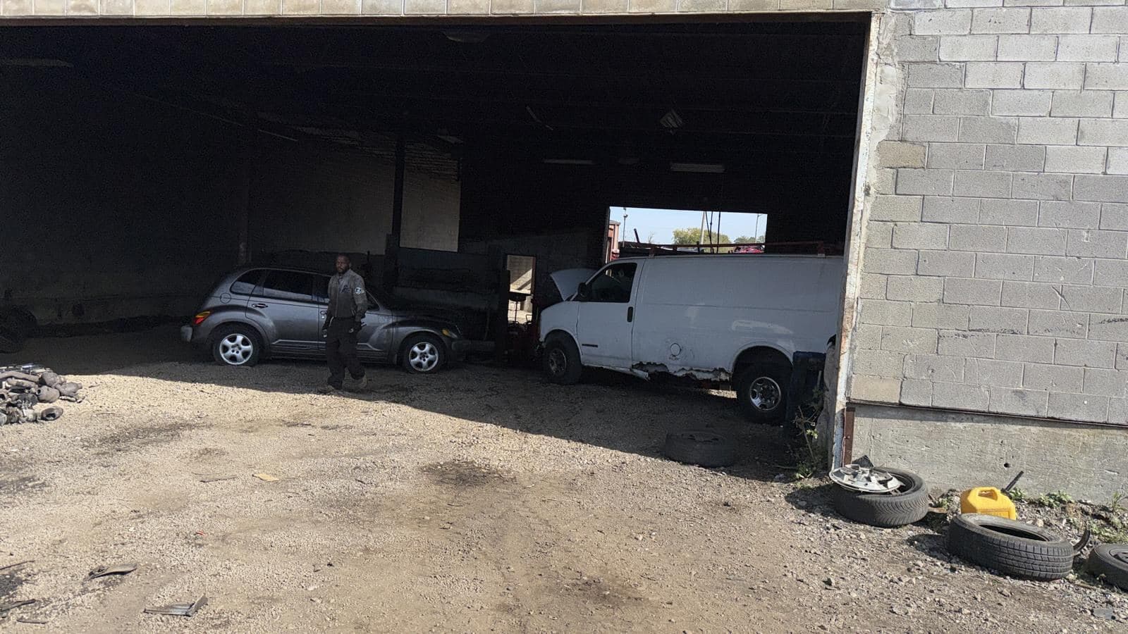 Open service bay with vehicles inside